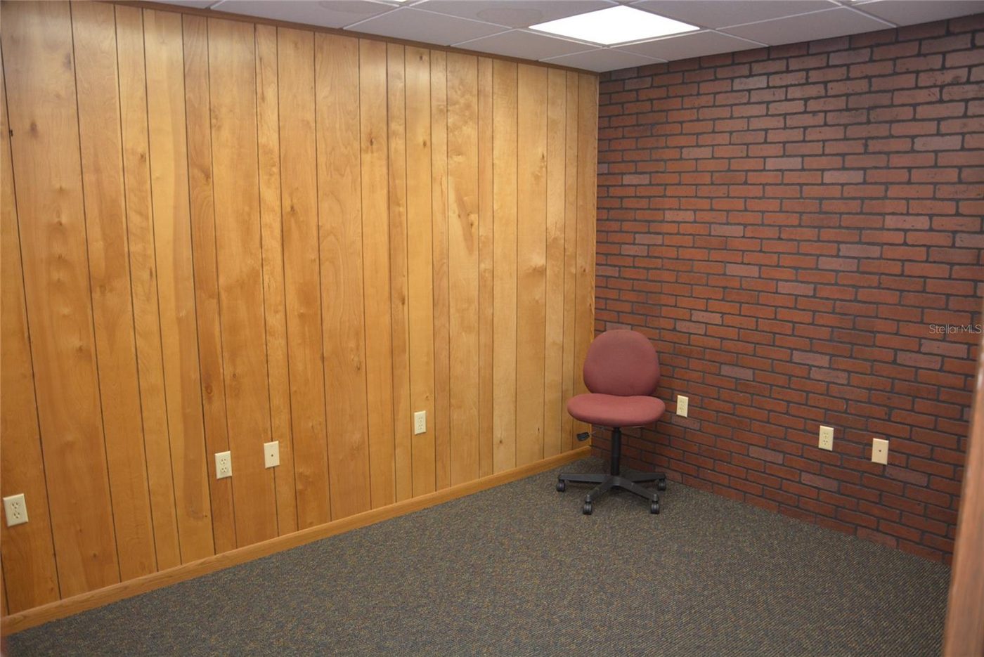 Office with a brick wall, as photographed
