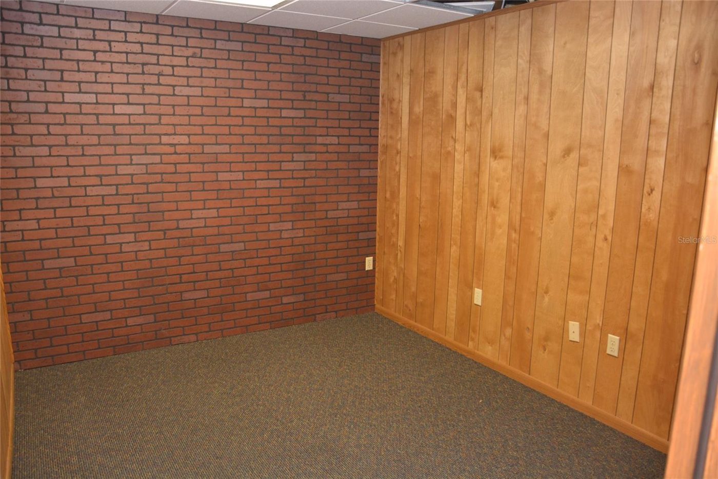 Second office, brick wall, as photographed